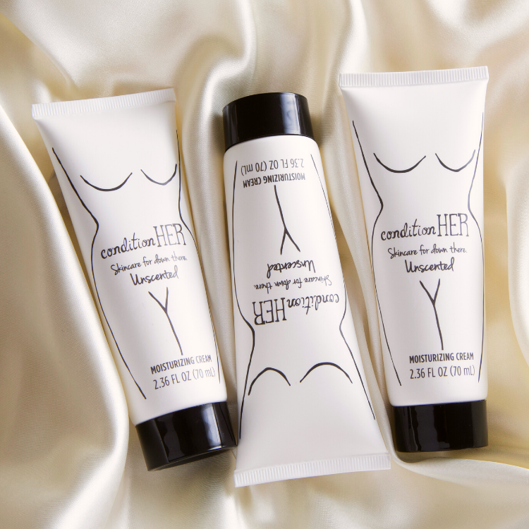 Closeup-of-three-tubes-of-conditionHERcream-on-beige-silk