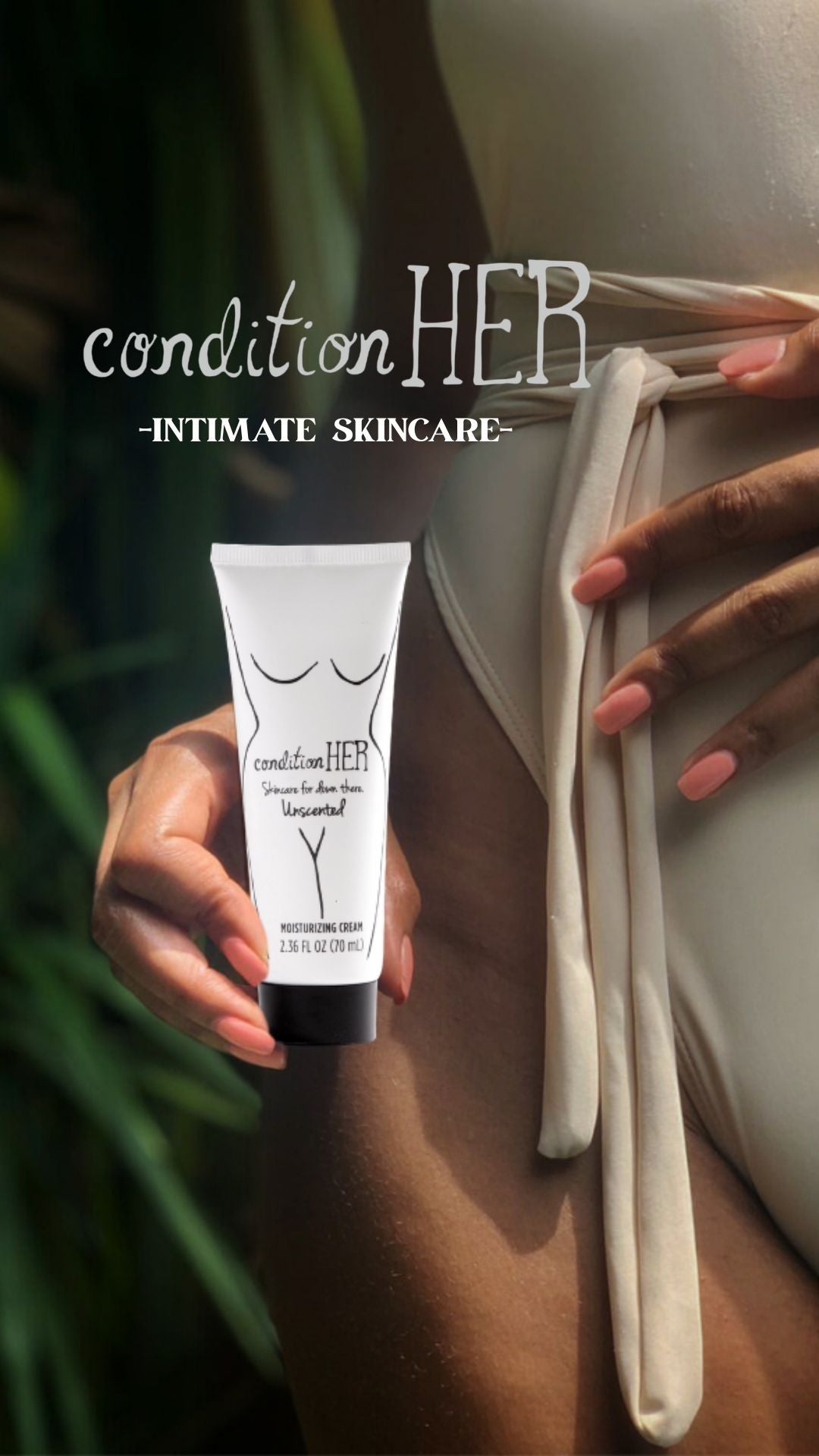 Hand holding a 'condition HER' intimate skincare product with a blurred background